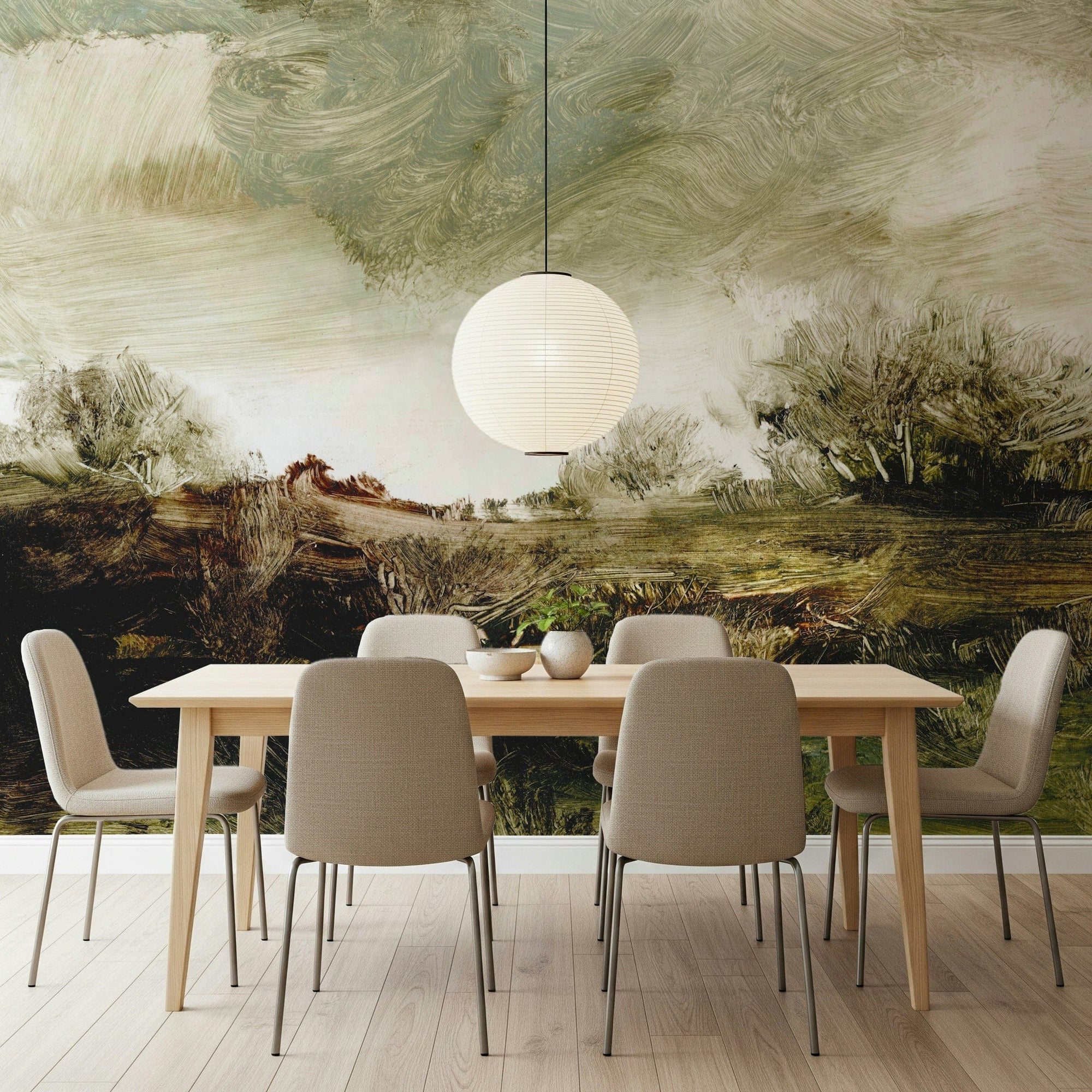 Brushstroke Landscape wallpaper mural of painterly green countryside above a wood dining table with beige chairs
