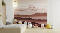 Burgundy Mountain Haze wallpaper of misty rose mountains in a kids room with a wood platform bed and plush animal toys