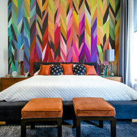 Rainbow-hued abstract art mural on feature wall

