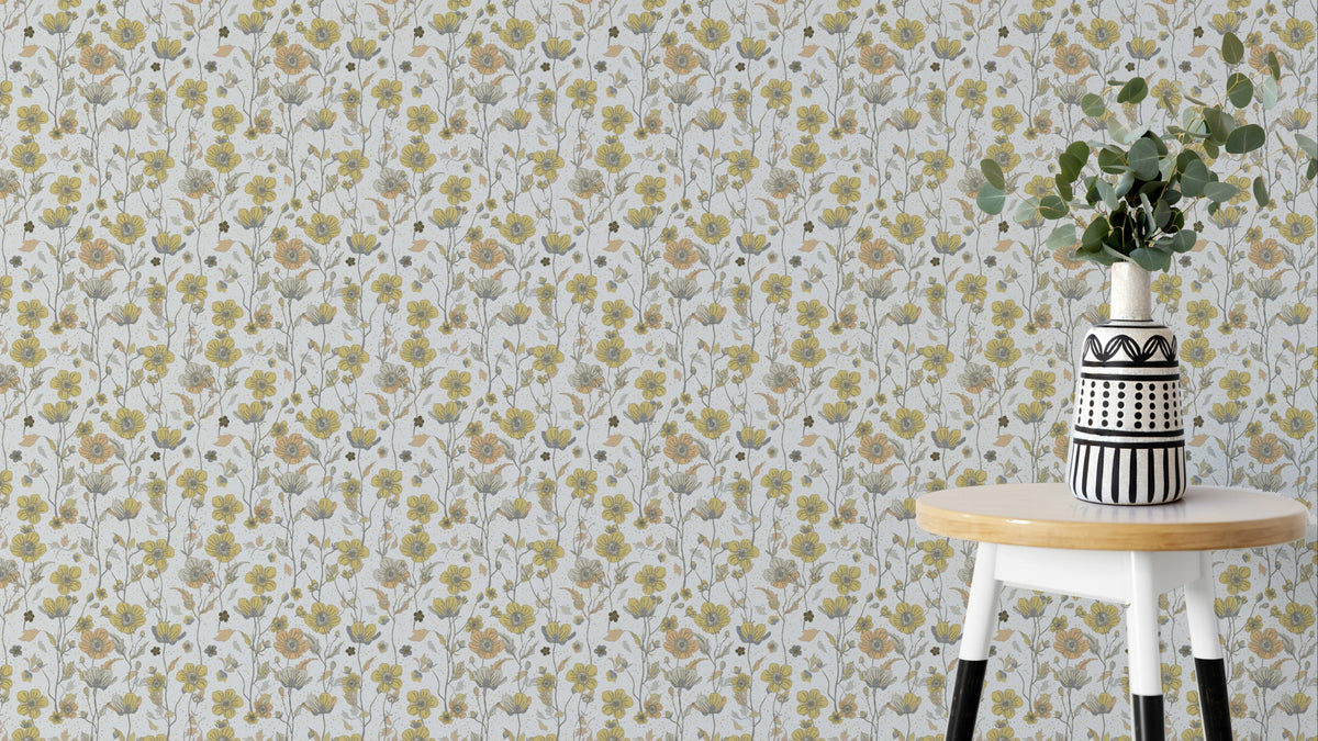 Buttercups Garden Golden and Gray wallpaper behind a white stool with eucalyptus in a striped vase