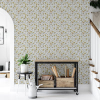 Buttercups Garden Golden and Gray wallpaper beside an industrial console cart and stairs in a hallway