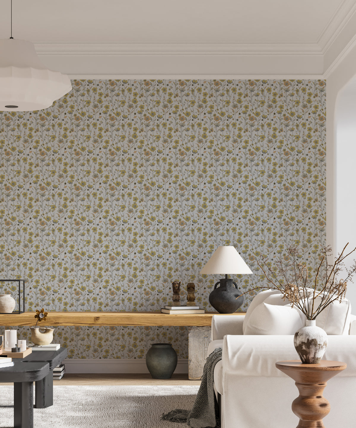 Buttercups Garden Golden and Gray wallpaper behind a white sofa and wooden bench in a bright living room