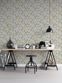 Buttercups Garden Golden and Gray wallpaper behind a wooden trestle desk and pendant lamp in a home office