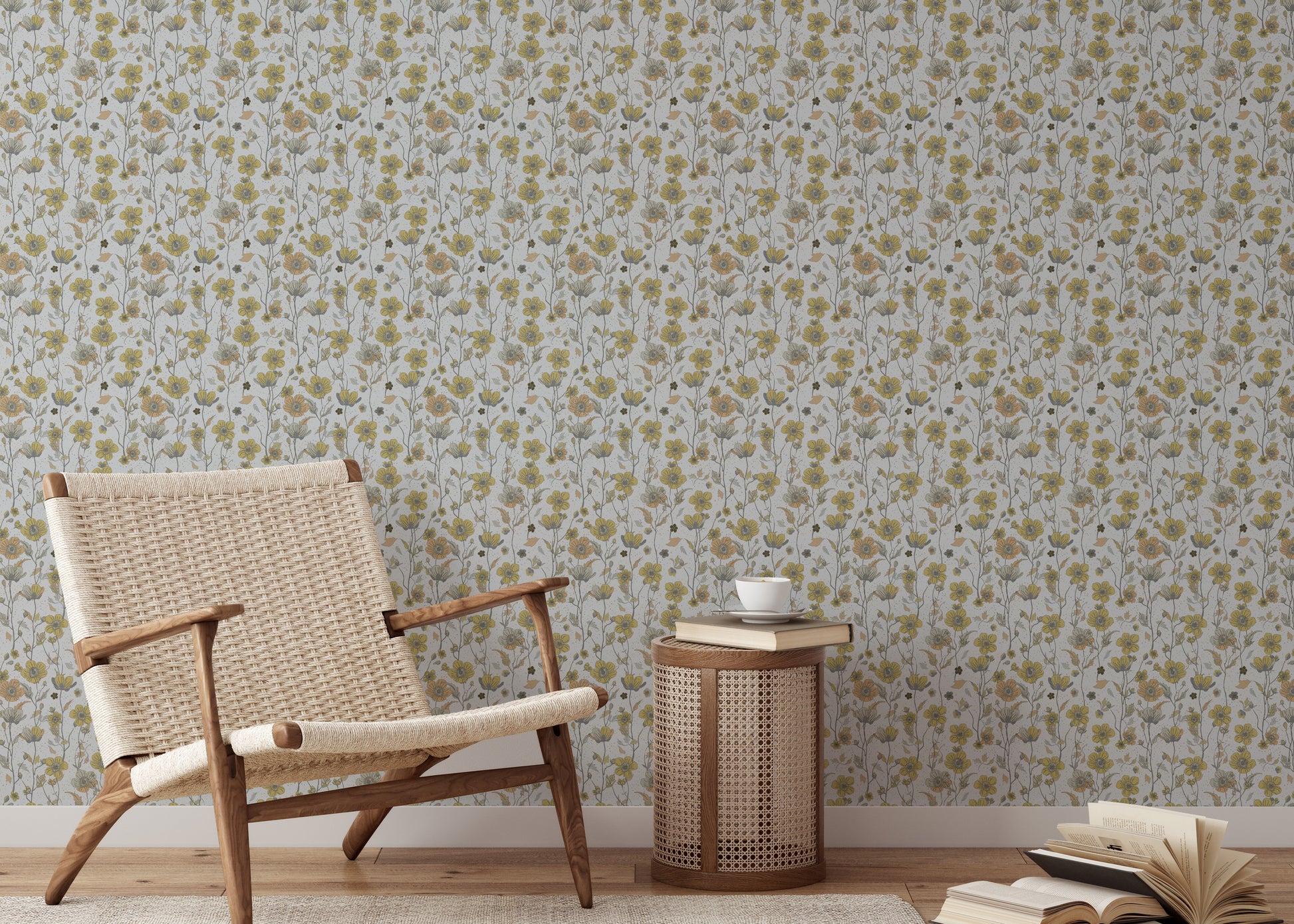 Buttercups Garden Golden and Gray wallpaper behind a woven rattan armchair and caned side table