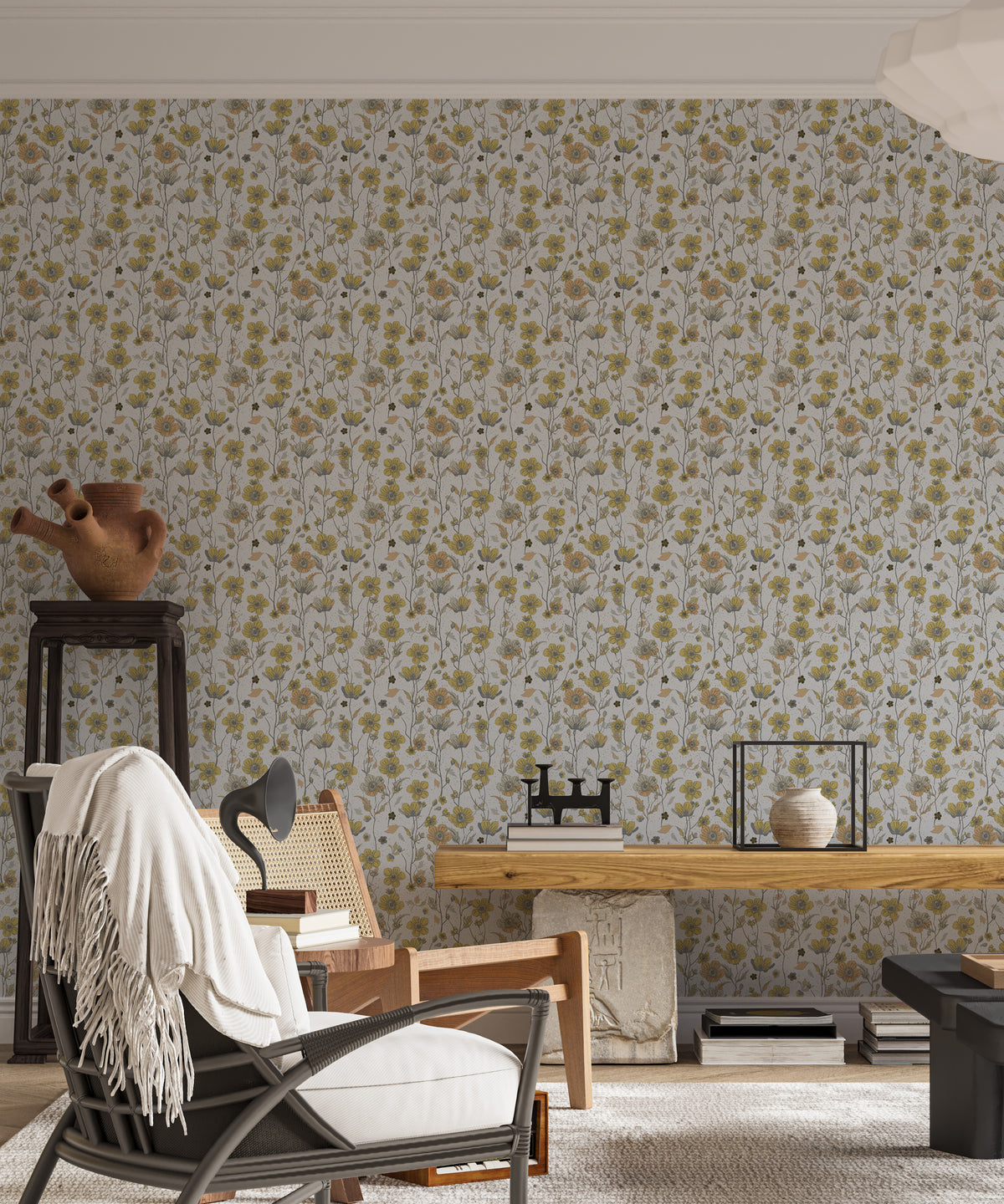 Buttercups Garden Golden and Gray wallpaper behind a caned armchair and wooden console in a living room