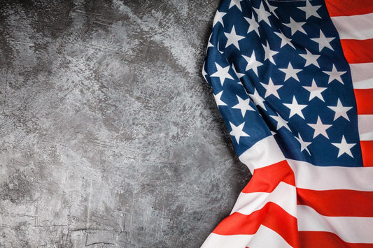 American Flag Rustic wallpaper close-up showing the stars and red and white stripes on a grey concrete surface