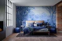 Autumn Forest Blue Color wallpaper mural of monochrome blue trees behind an upholstered bed with exposed brick wall