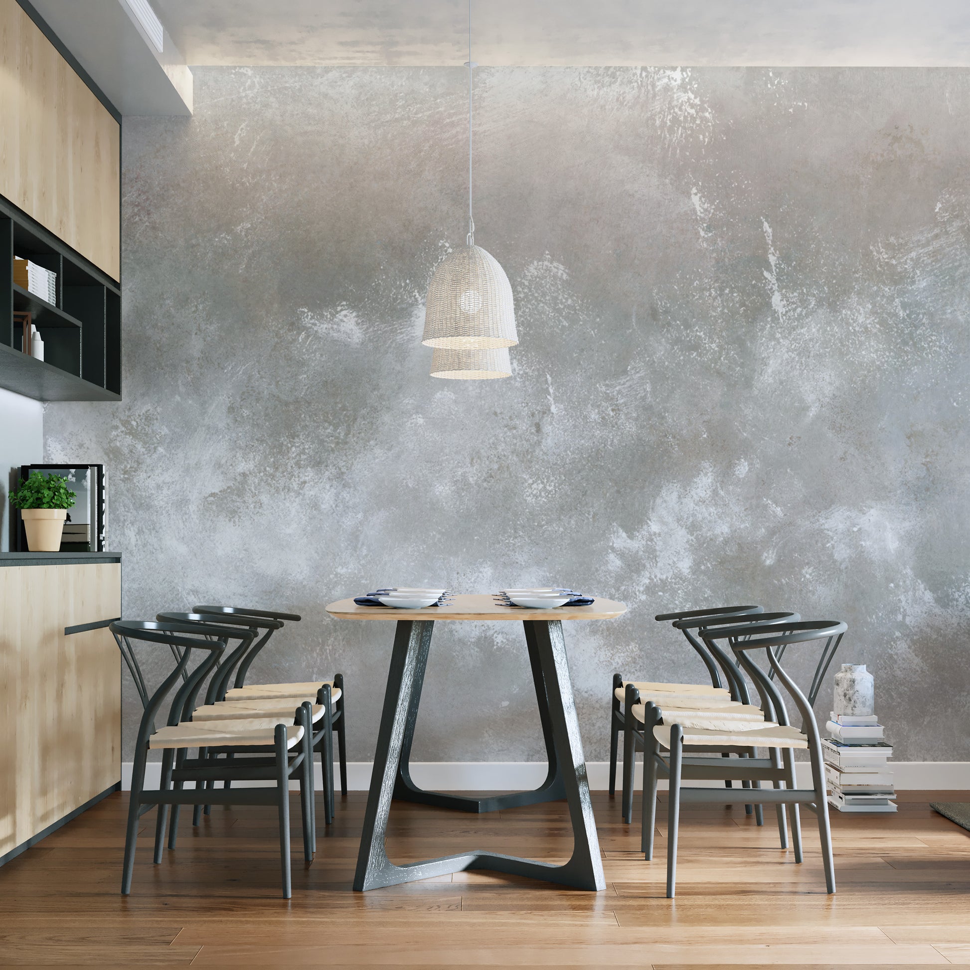 Baltic Sand Textured Abstract wallpaper mural in mottled grey plaster behind a round table and black wishbone chairs in a dining room