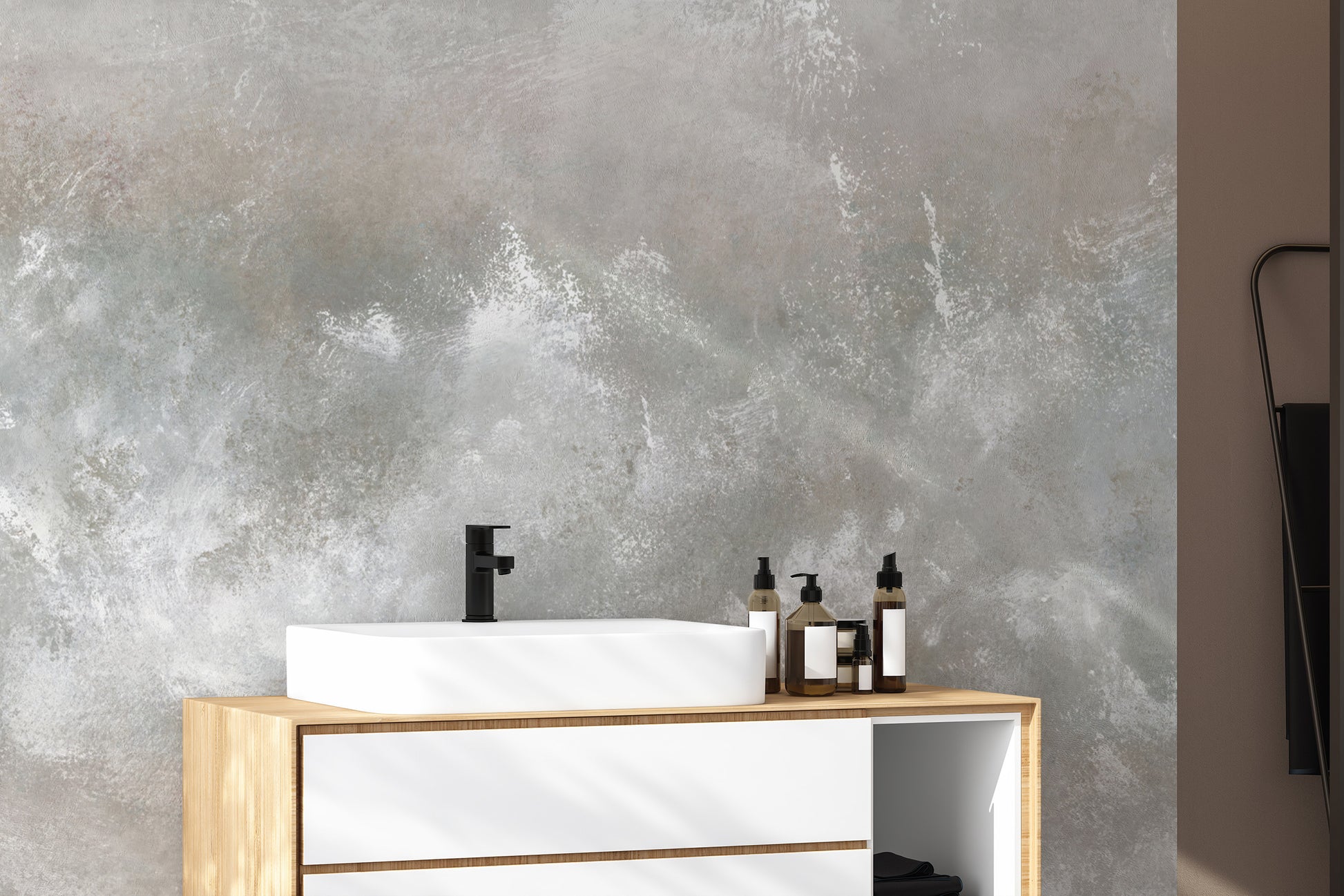 Baltic Sand Textured Abstract wallpaper mural in grey behind a white vessel sink on a wood vanity in a bathroom