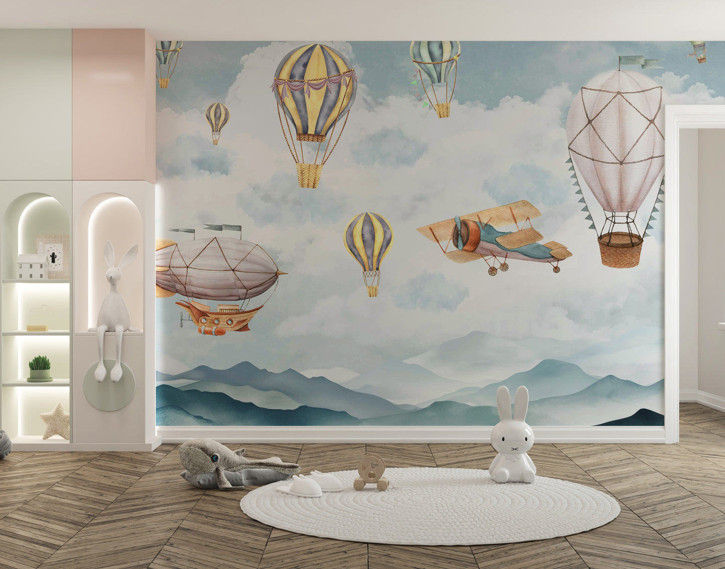 Cloud Drifter Airships Wall mural of pastel hot-air balloons and airships in a kids room with a round rug