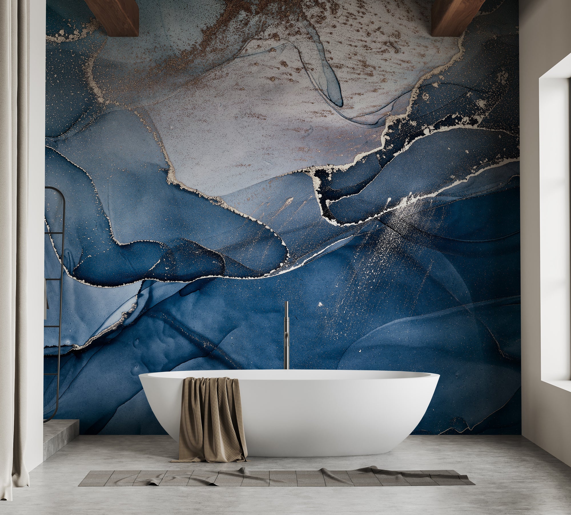 Blue Alcohol Ink Colors wallpaper mural in navy and gold behind a white freestanding bath on a concrete floor