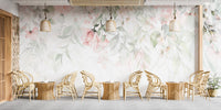 Ethereal Rose Garden mural of soft pink roses behind a row of rattan chairs and woven pendant lights