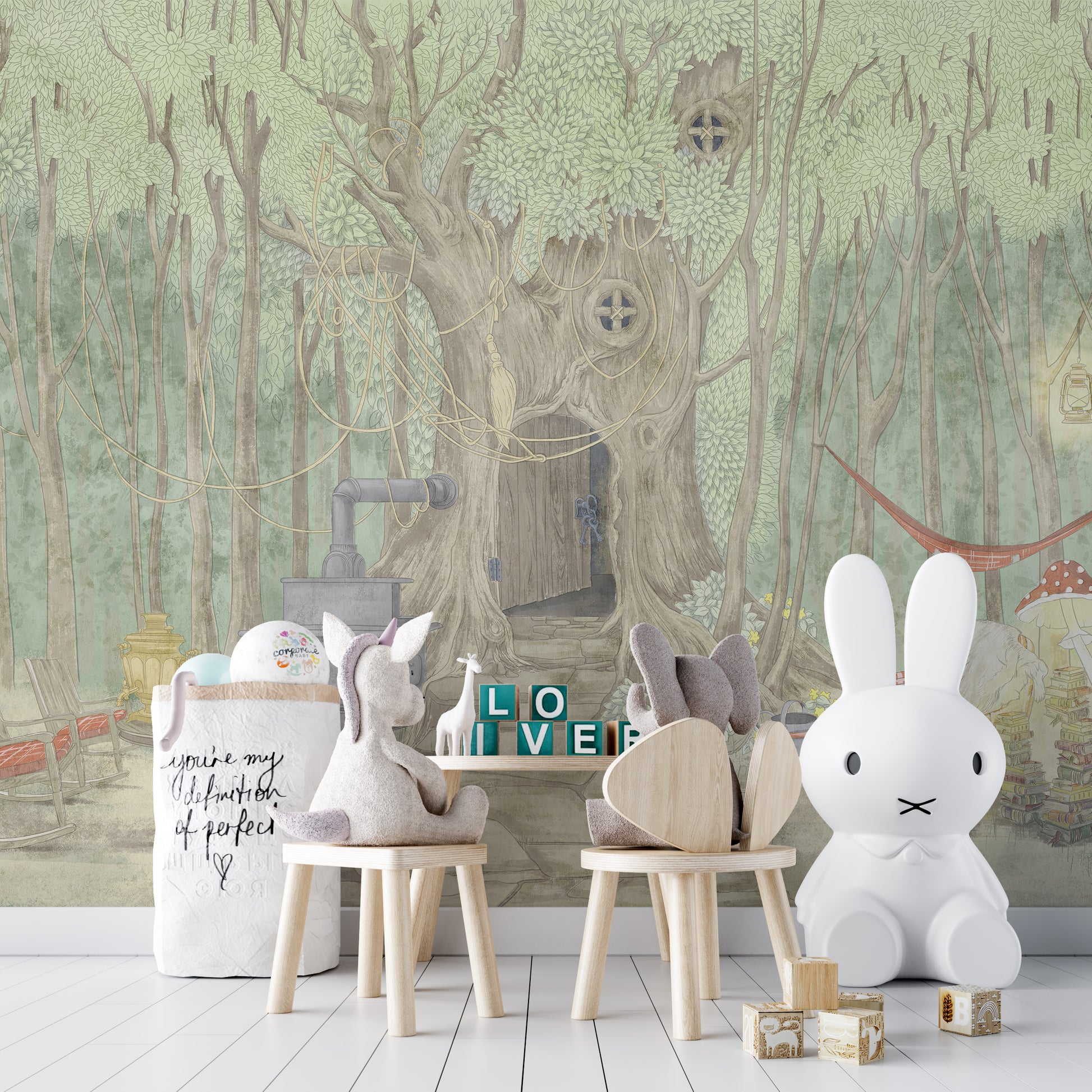 Fairyland Cascade mural with whimsical forest tree house behind bunny-eared kids chairs and a white Miffy lamp