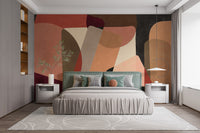 Standard finish Geometric Fusion Wall Mural as a headboard alternative in a bedroom with green accent pillows and decor.