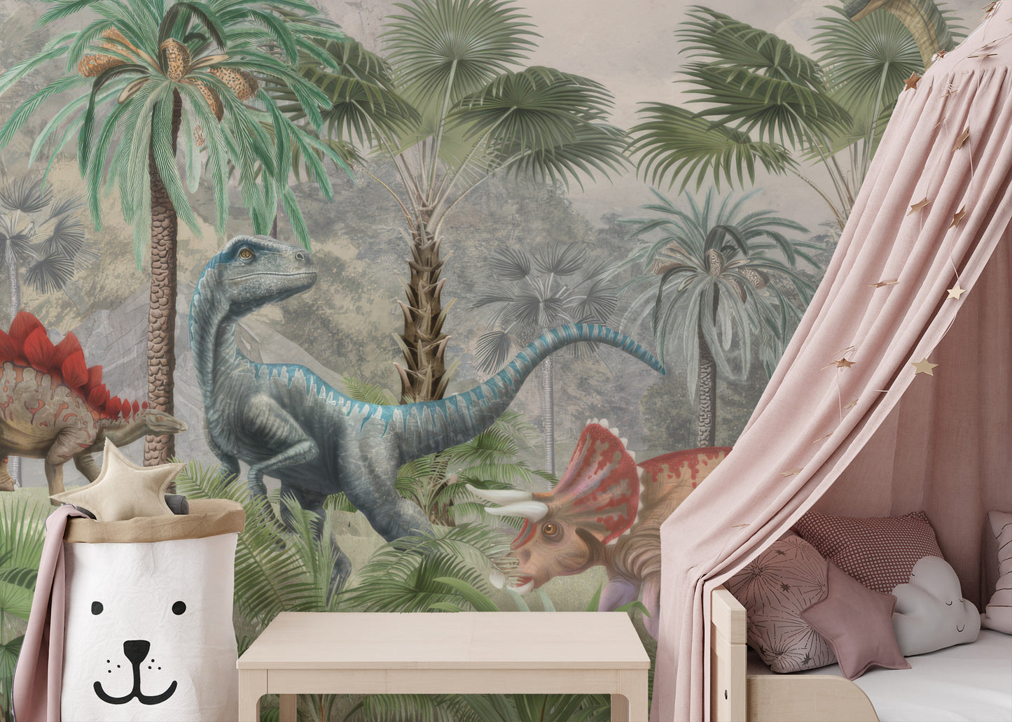 Mesozoic Mingle wallpaper mural of a blue raptor and triceratops behind a kids bed with a pink star canopy
