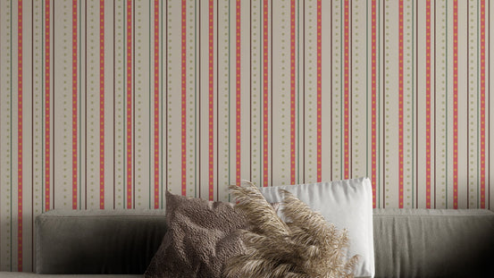 Parisian Pinstripe Elegance wallpaper in cream with coral stripes behind a grey sofa in a living room