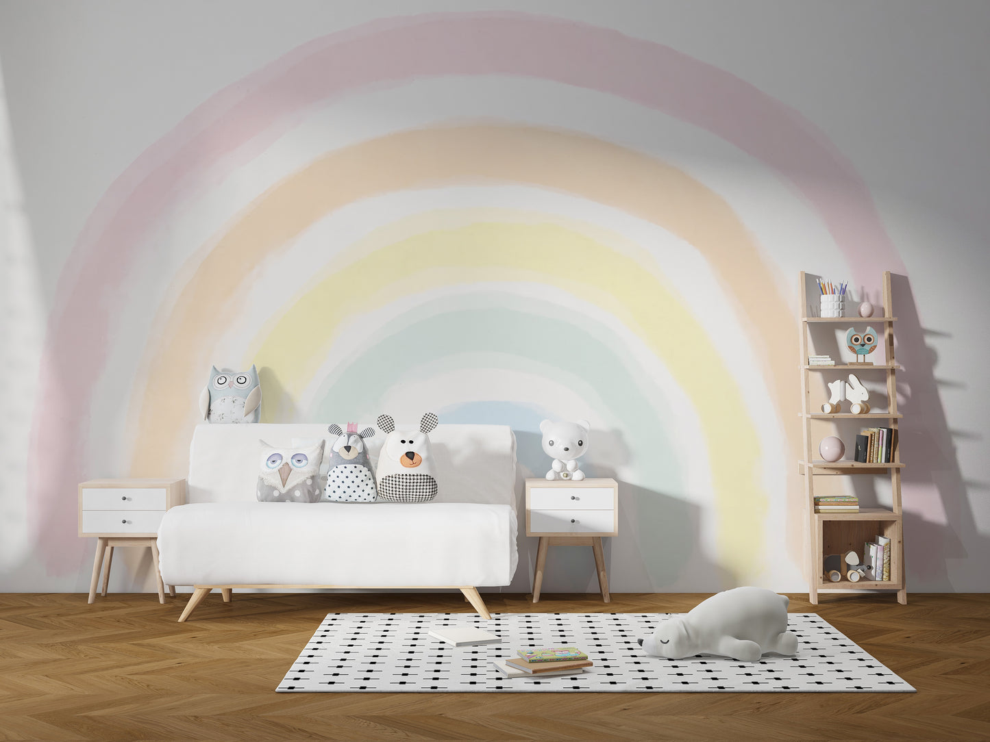 Pastel Rainbow wallpaper mural in a kids room above a white sofa with plush owl and bear toys and polka-dot rug