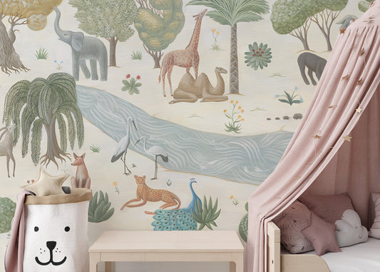 Safari Whispers wallpaper mural with a soft savanna of elephant and giraffe beside a dusty-pink canopy bed and bear laundry bag
