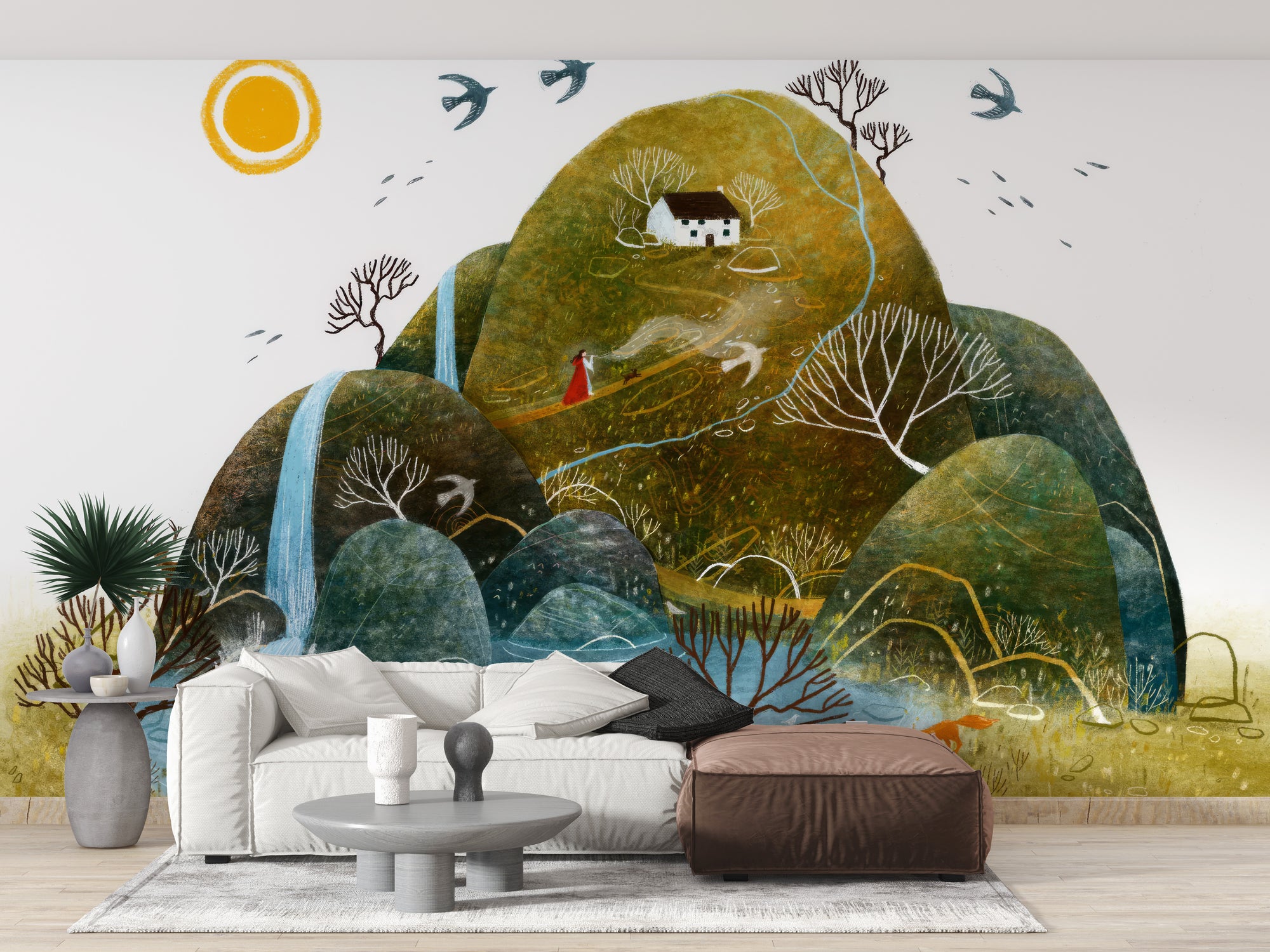 Serene Nature wallpaper mural of green hills, a white cottage and waterfall behind a white sofa and brown ottoman in a living room