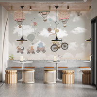 Dreamy Nursery Animal Adventure wallpaper mural as a bedroom feature wall behind the headboard in gray tones