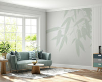 A serene wallpaper with large, airy bamboo leaves in gentle pastel green tones.