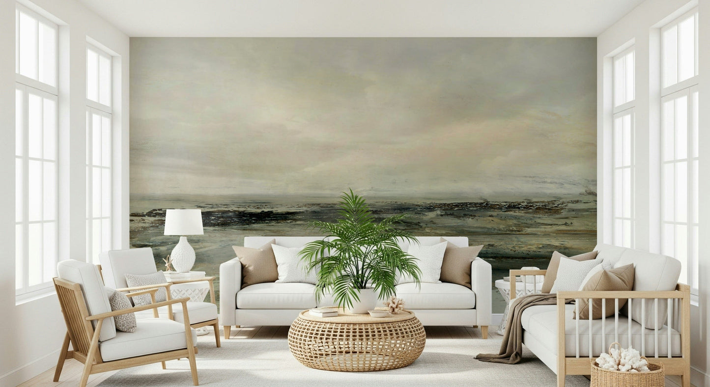 Coastal Hues wallpaper mural of a hazy green seascape behind a white sofa and rattan table in a bright sunroom
