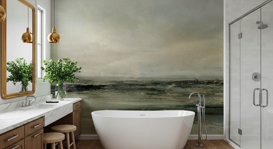 Coastal Hues wallpaper mural of a moody olive green shoreline behind a freestanding tub in a wood-vanity bathroom