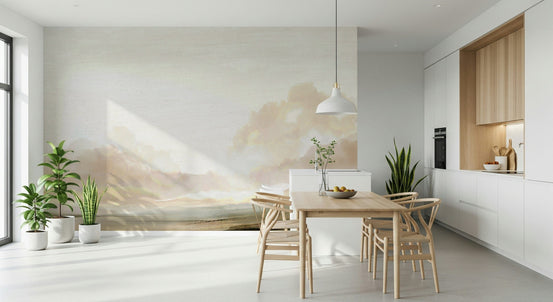 Tranquil Horizon wallpaper mural of a soft cream cloudy sky behind a light wood dining table and wishbone chairs in a kitchen