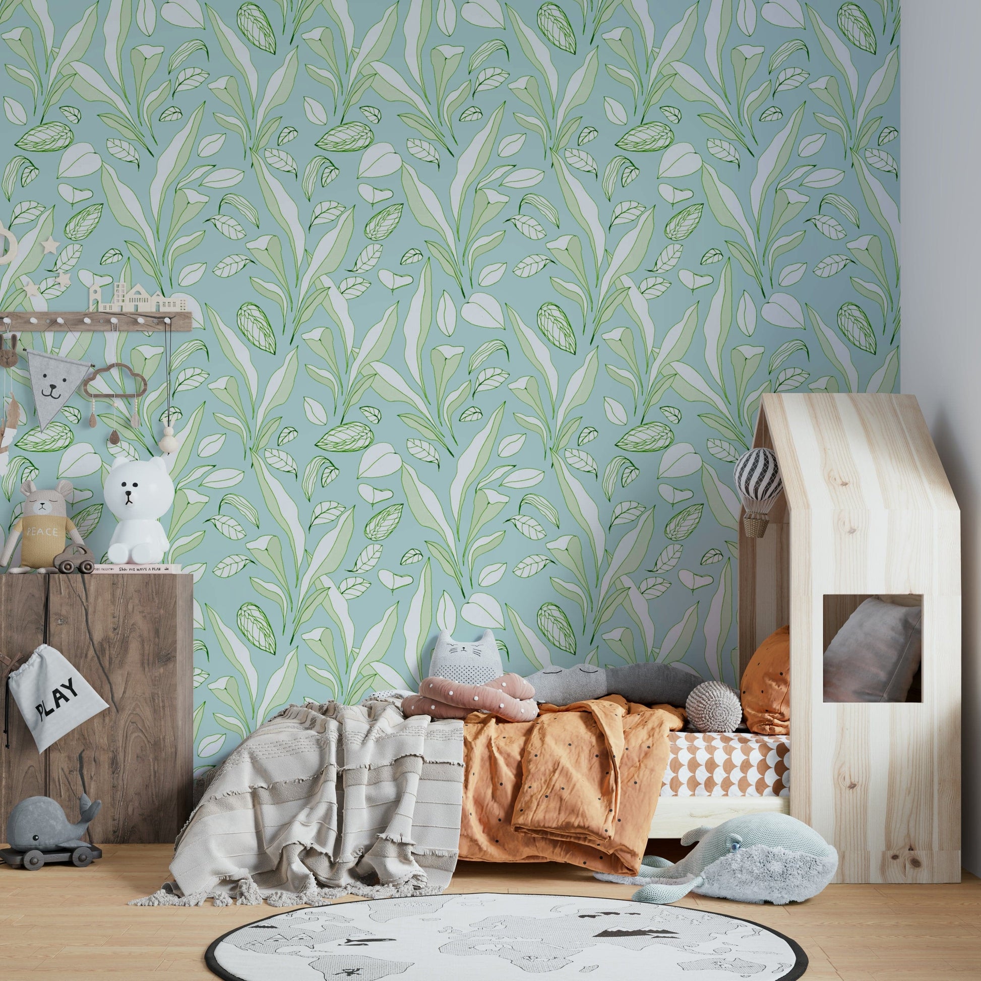 The design is a dense, overlapping pattern of tropical foliage.
