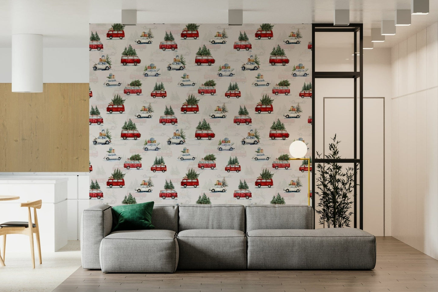 Camionette wallpaper with red Christmas-tree vans behind a grey modular sofa and potted plant in a living room