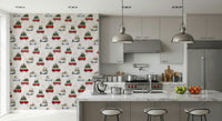 Camionette wallpaper of red vans carrying Christmas trees on a kitchen feature wall with grey cabinets and island