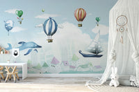 Hot Air Balloon Kids Room wallpaper mural as a bedroom feature wall behind the headboard in a multicolour palette