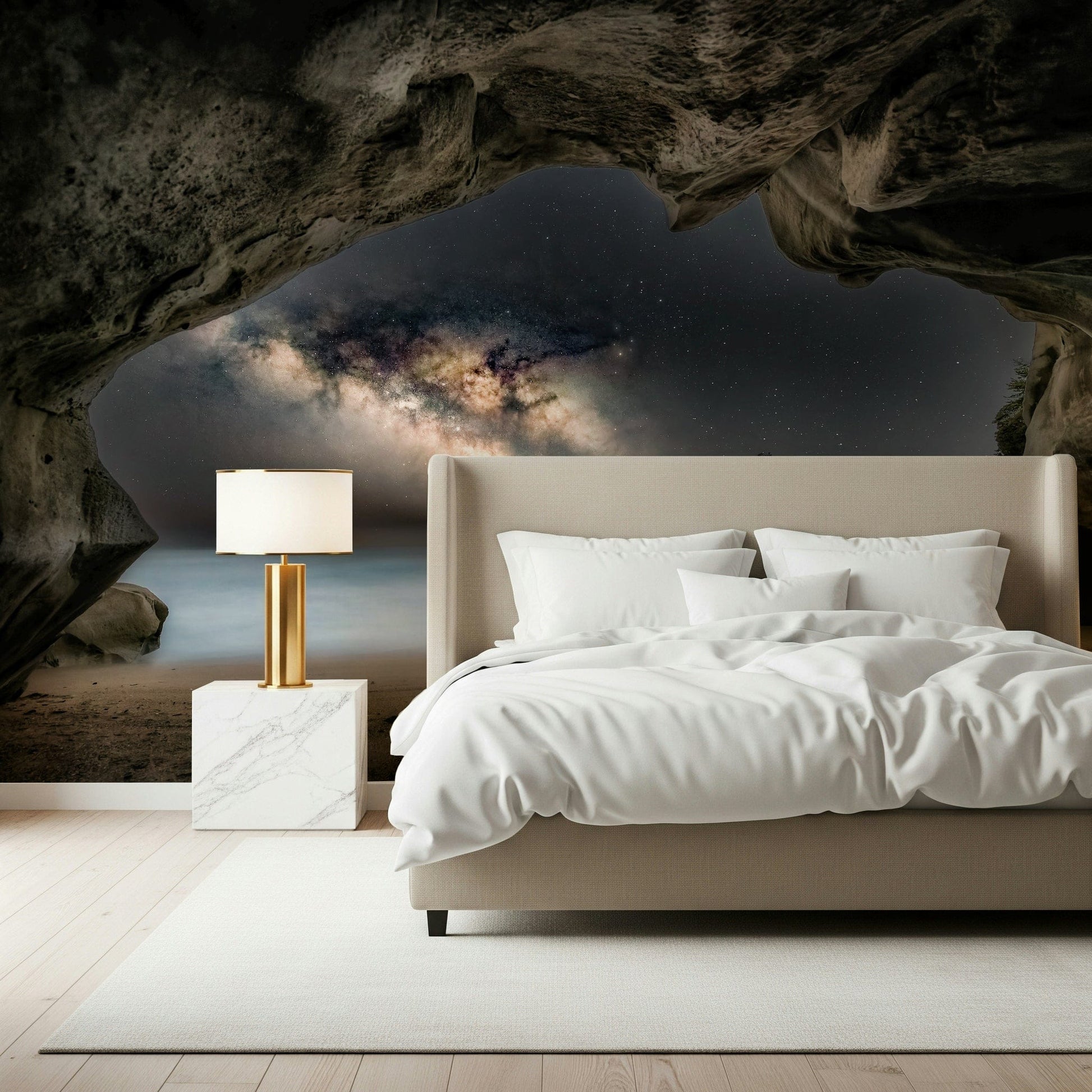Cave Portal to Starlight wallpaper mural of a glowing galaxy in a cave above a beige bed in a calm bedroom