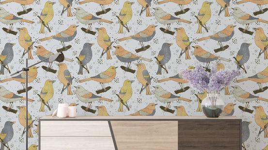 Birds Golden and Gray wallpaper showing perched songbirds above a sideboard with a lilac vase and candles