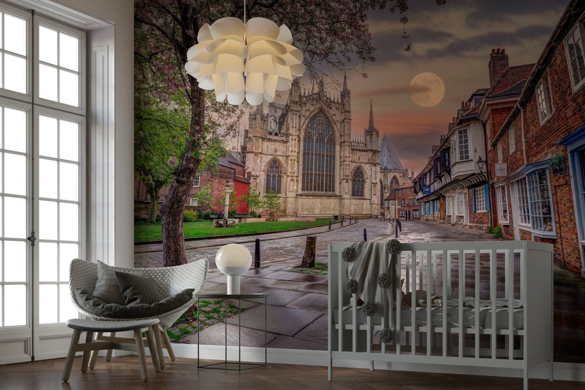 A tree with some spring blossoms is visible in the foreground.
