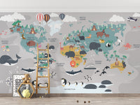 Children's World Map wallpaper with whales and penguins behind a wood ladder and teddy bear in a kids room