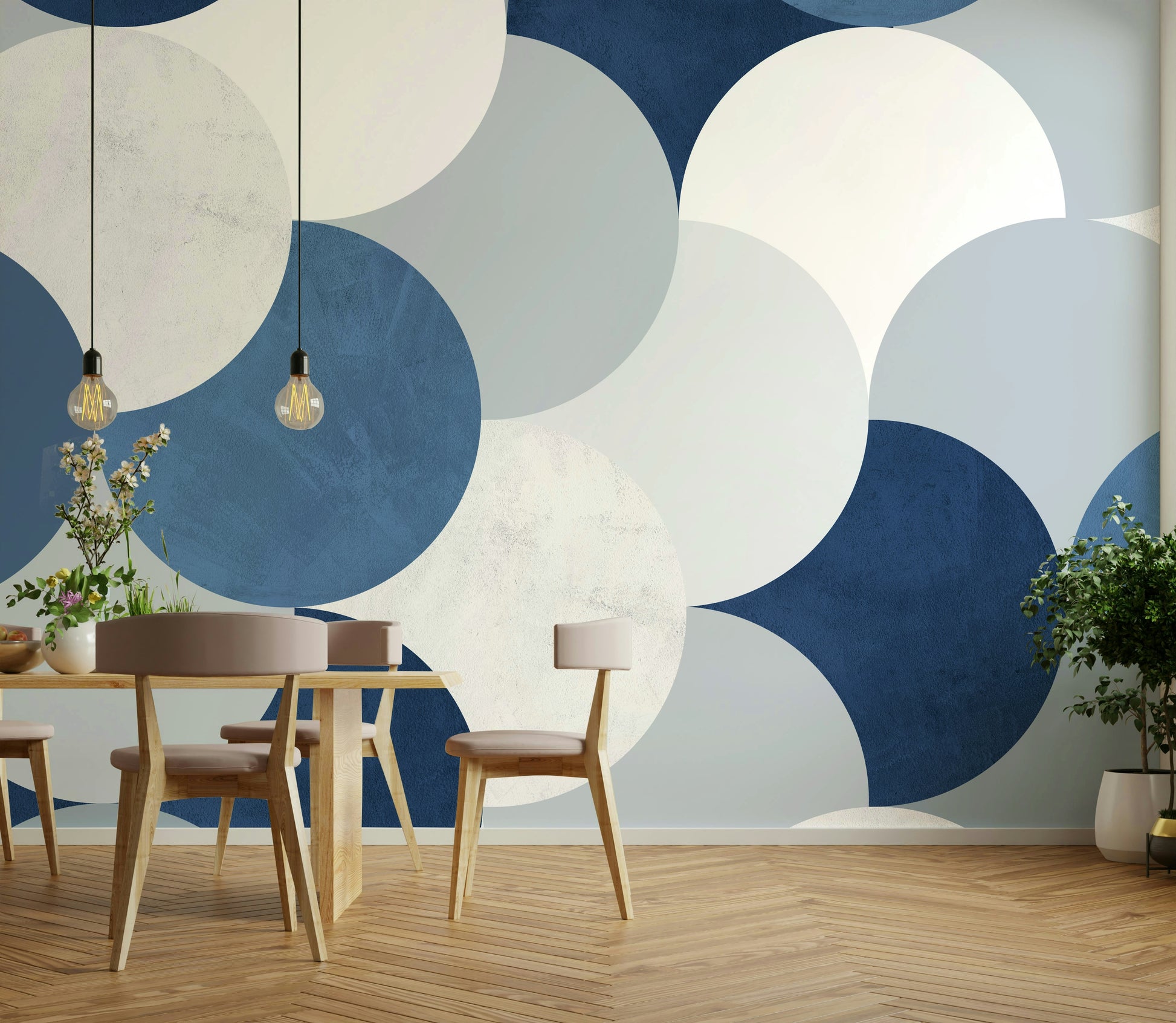 Circle Abstract wallpaper mural of navy and cream half-circles behind a wood dining table and beige chairs
