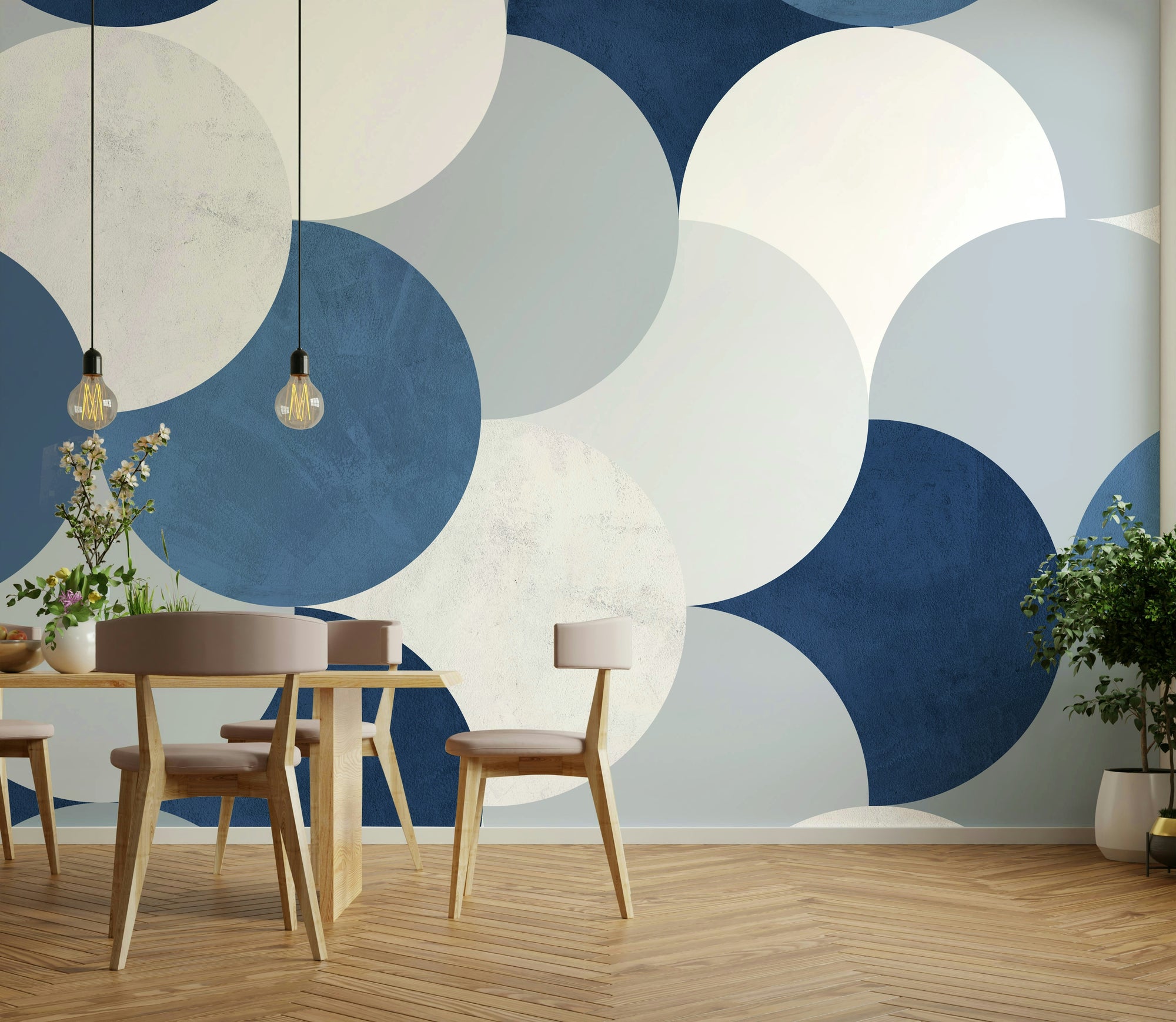 Circle Abstract wallpaper mural of navy and cream half-circles behind a wood dining table and beige chairs