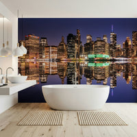 Night skyline reflection mural in entryway, modern city scene behind timber console