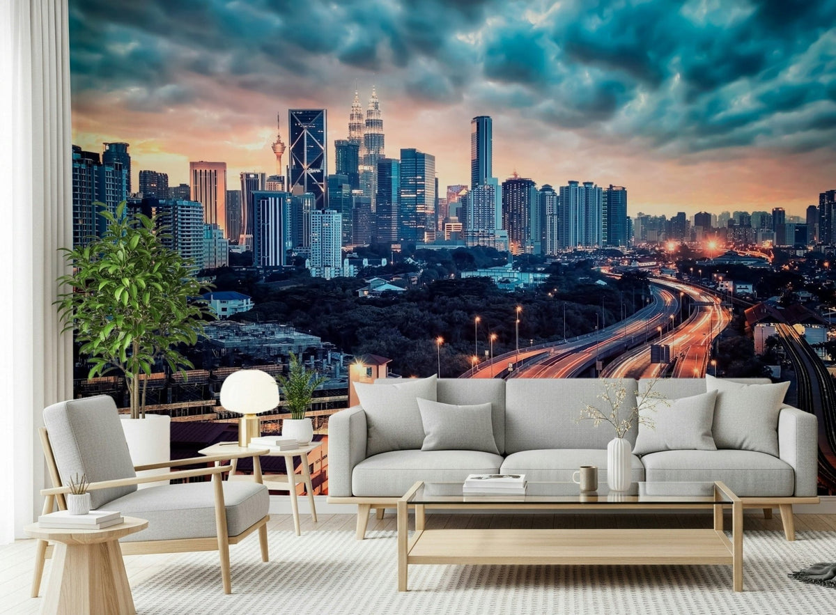 Cityscape Dawn wallpaper mural with Kuala Lumpur skyline and red highway trails behind a gray sofa in a bright living room