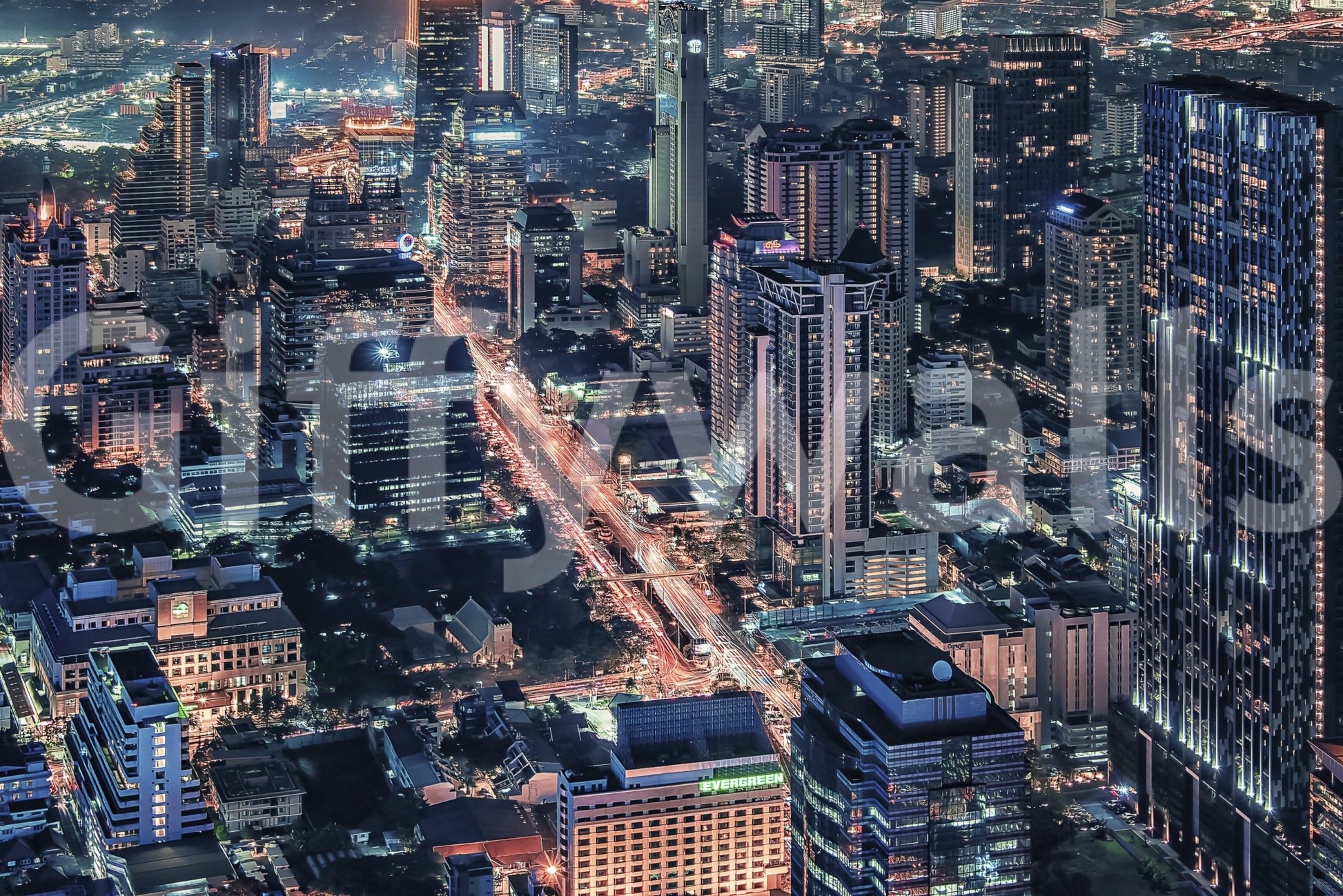 Cityscape Night wallpaper mural close-up showing the aerial skyline with orange traffic trails and lit towers