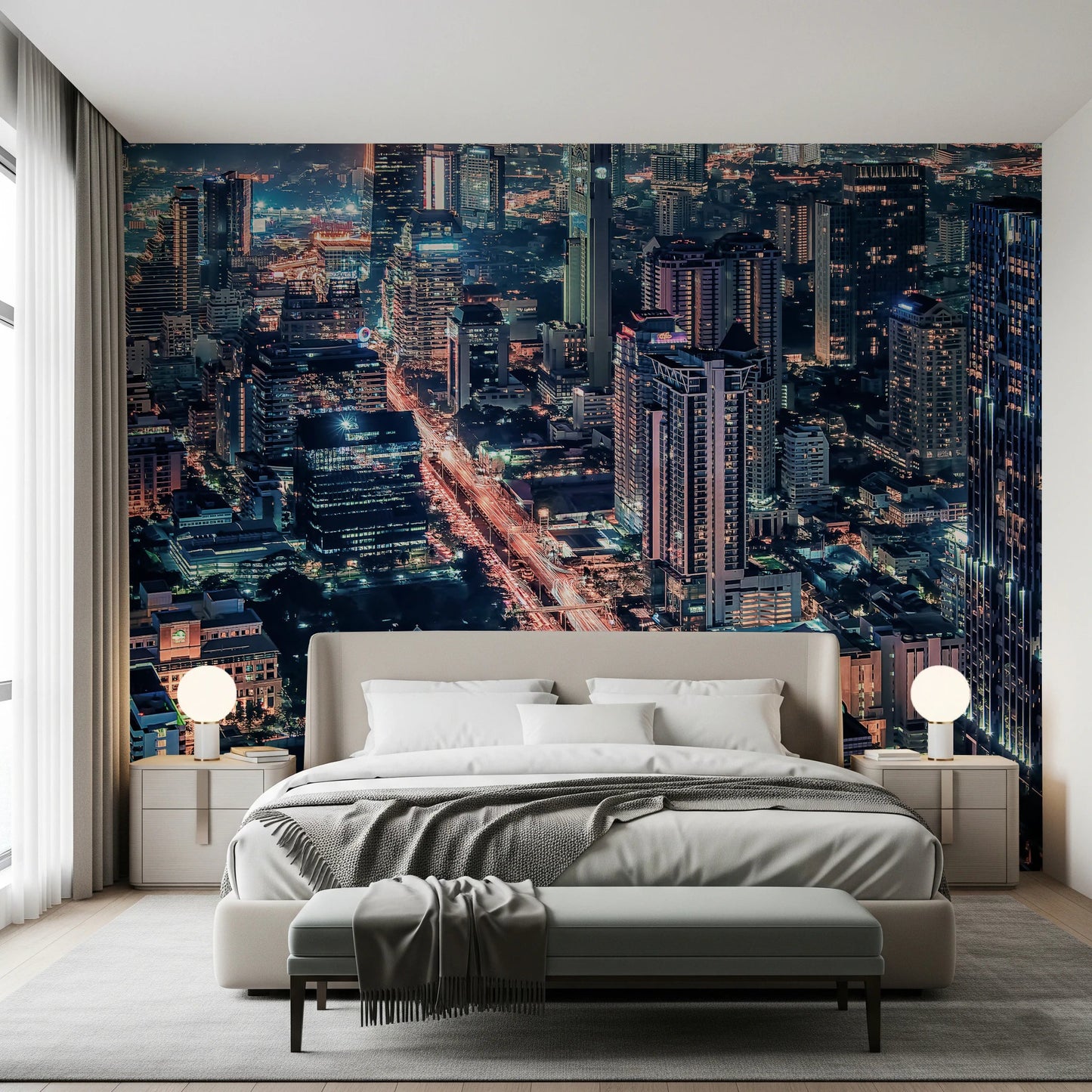 Cityscape Night wallpaper mural of skyscrapers at dusk behind a cream upholstered bed with globe lamps