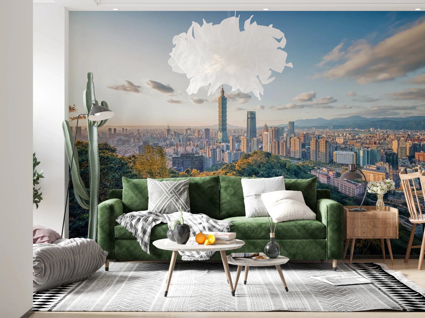 Cityscape Vista wallpaper mural of the Taipei skyline over hills above a grey sofa and black metal coffee table