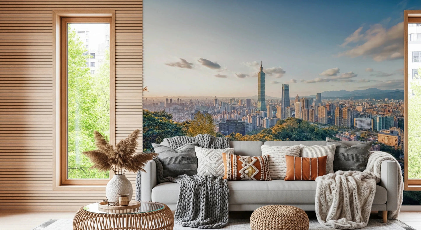Cityscape Vista wallpaper mural of Taipei over forested hills behind a green sofa and cream lounge chair