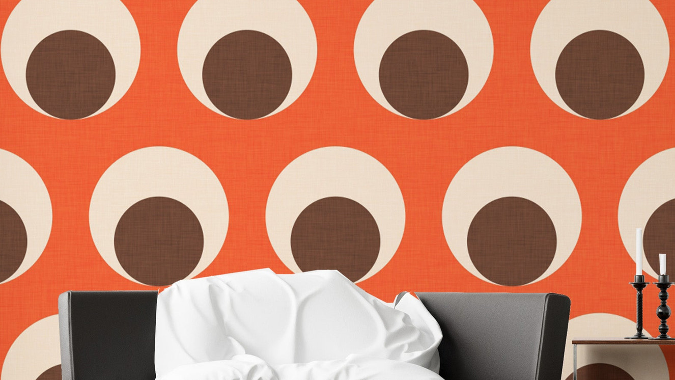 Retro orange dotted wallpaper with eye motifs
