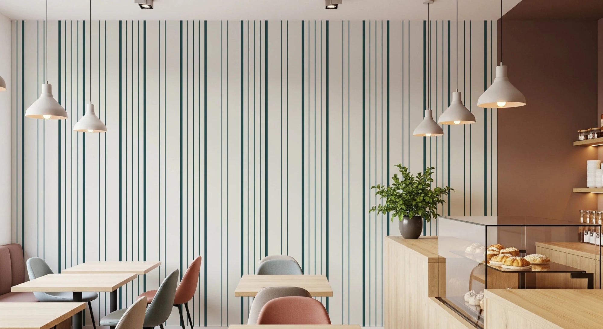 Classic Stripe wallpaper in a cafe with pendant lights, wood tables, pastel chairs and a pastry counter