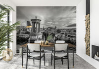 Classical City Charm wallpaper mural of grey Edinburgh skyline behind a wooden dining table with cream chairs and arc floor lamp