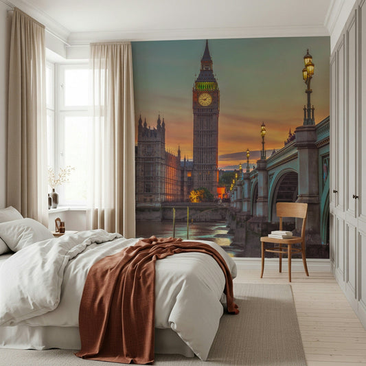 Clock tower wallpaper mural of Big Ben at sunset behind a white bed with a rust throw in a bedroom