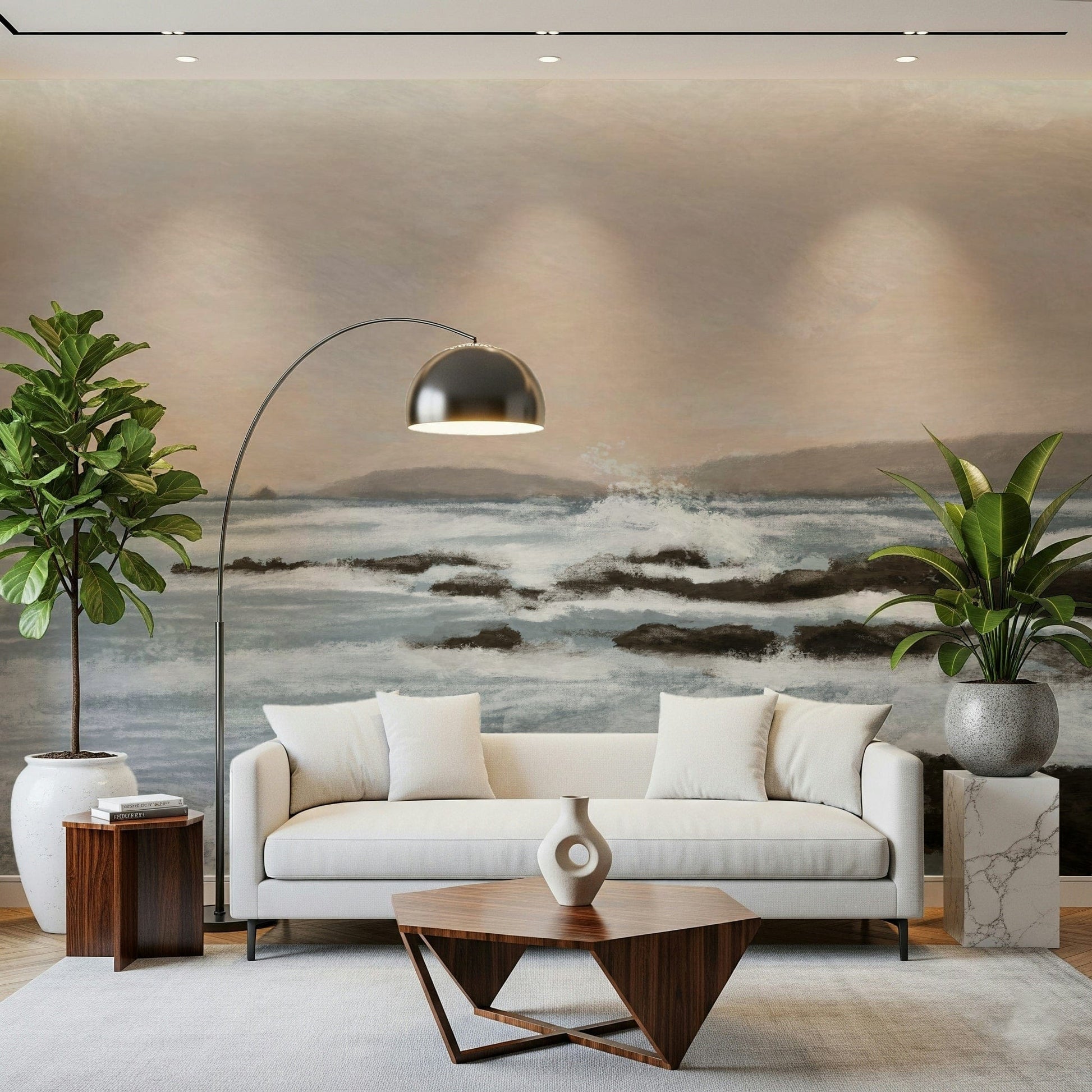 Coastal Hues wallpaper mural of grey-blue surf and rocks behind a white sofa and chrome arc lamp in a living room