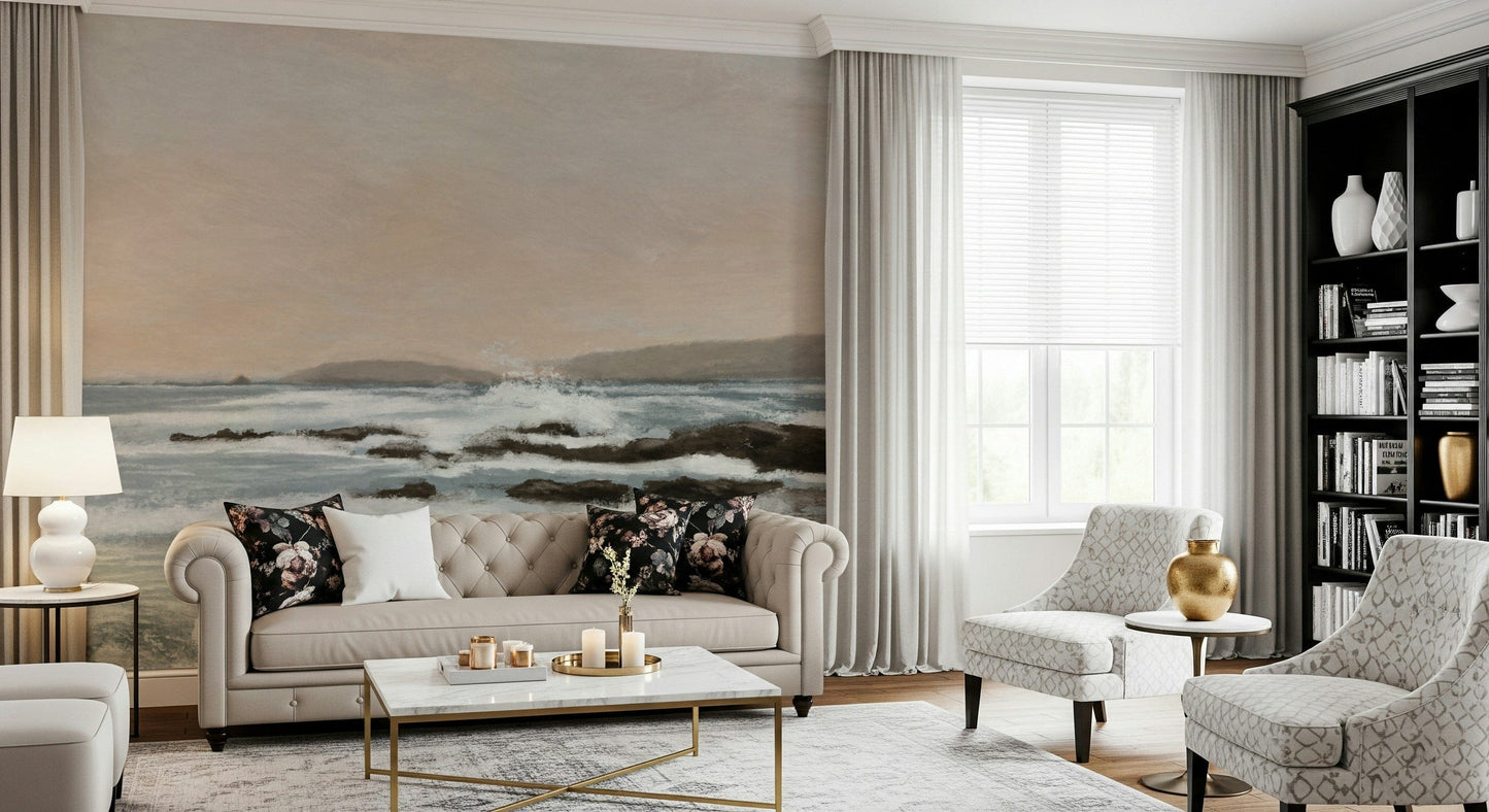 Coastal Hues wallpaper mural of breaking waves behind a beige tufted Chesterfield sofa with floral cushions in a living room